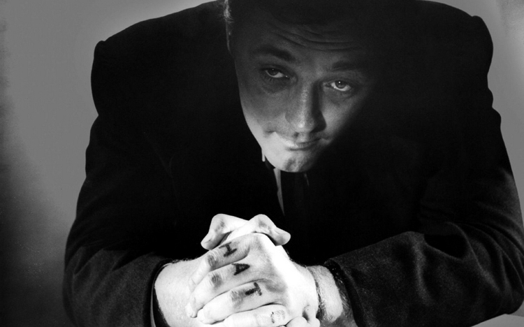 Robert Mitchum, Harry Powell nella pellicola di Charles Laughton